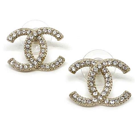 boucle d oreille chanel métal et strass|Boucles d'oreilles .